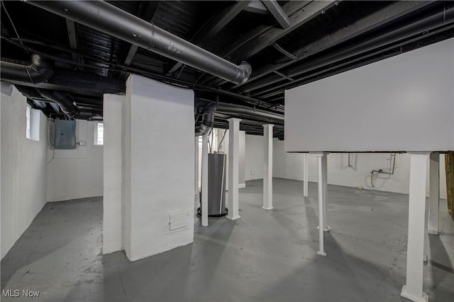 basement featuring gas water heater and electric panel