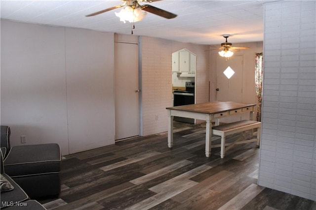 dining room featuring ceiling fan and dark hardwood / wood-style flooring