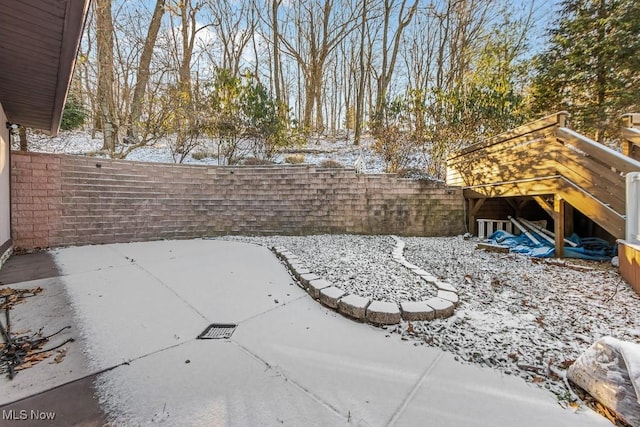 view of yard layered in snow