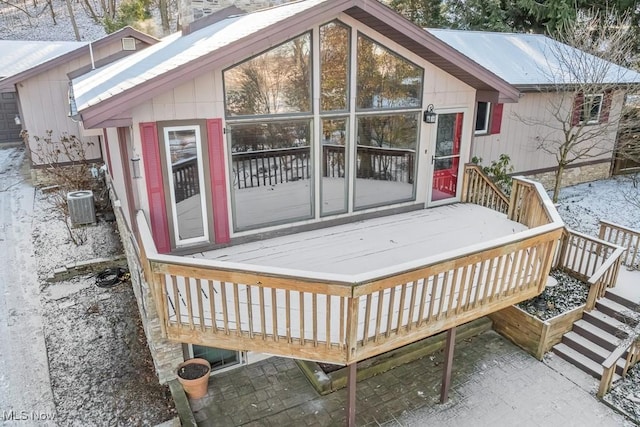 snow covered deck featuring central AC