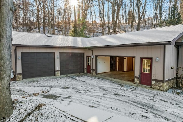 view of snow covered garage