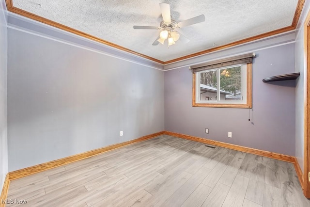 unfurnished room with a textured ceiling, light hardwood / wood-style flooring, and crown molding