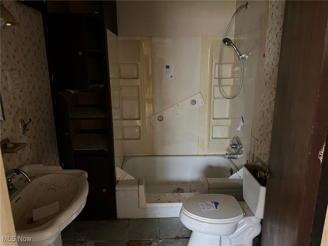 bathroom with tile patterned floors, a shower, sink, and toilet