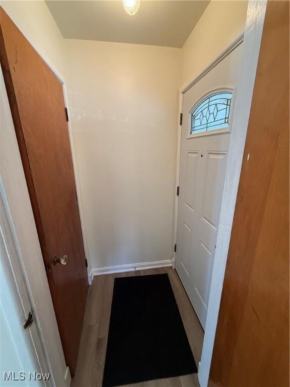 doorway to outside with hardwood / wood-style flooring