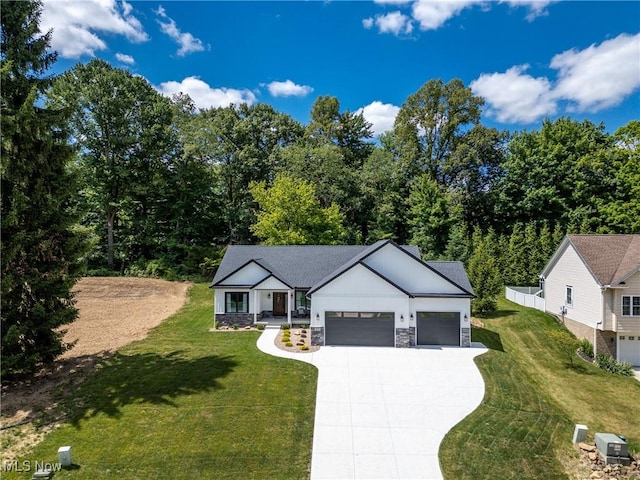 view of front of home featuring a garage and a front lawn