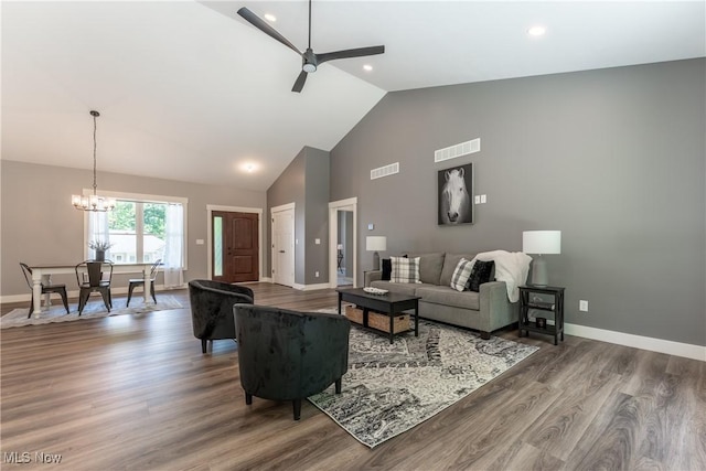 living room featuring high vaulted ceiling, wood-type flooring, and ceiling fan with notable chandelier