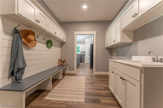 mudroom featuring dark hardwood / wood-style floors and sink