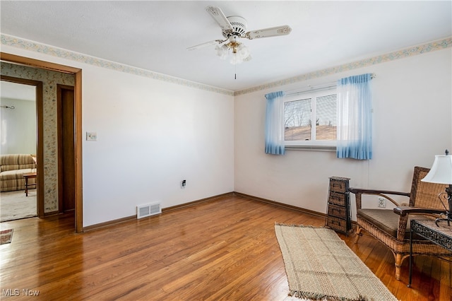 interior space featuring ceiling fan and wood-type flooring