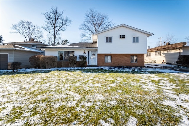 snow covered house with a lawn