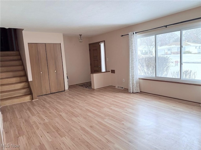 interior space with light hardwood / wood-style flooring and a closet