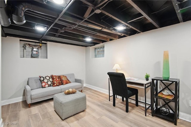 home office with hardwood / wood-style floors