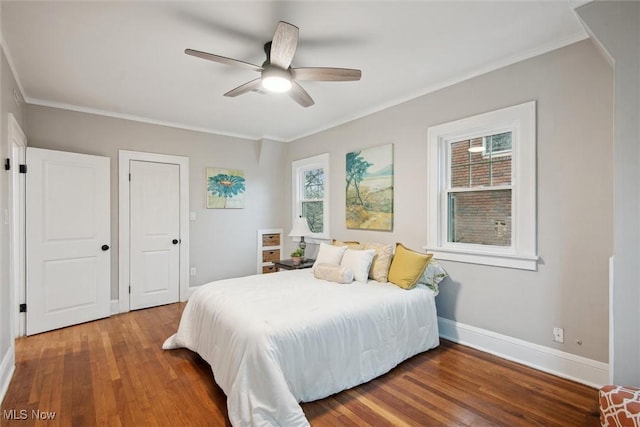 bedroom with ceiling fan, wood-type flooring, and ornamental molding