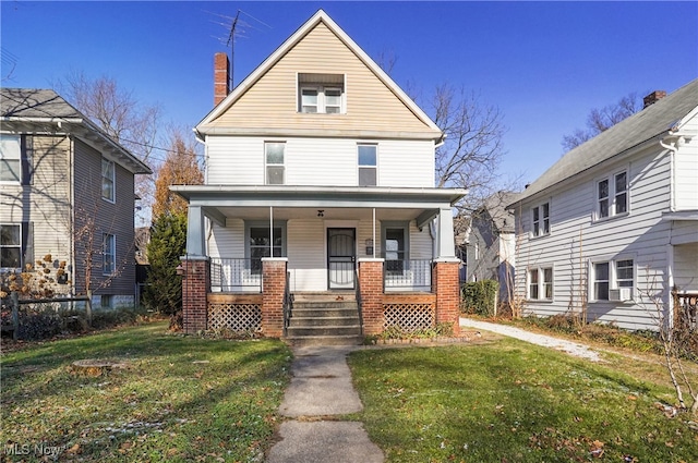 view of front facade featuring covered porch, a front lawn, and cooling unit