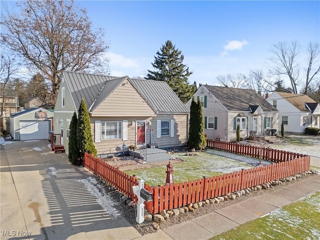 view of front of home featuring a garage and an outdoor structure