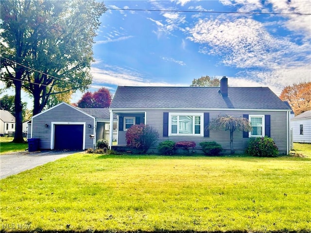 view of front of home featuring a garage and a front yard