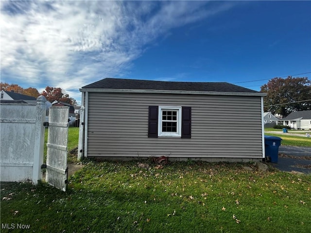 view of side of home featuring a lawn