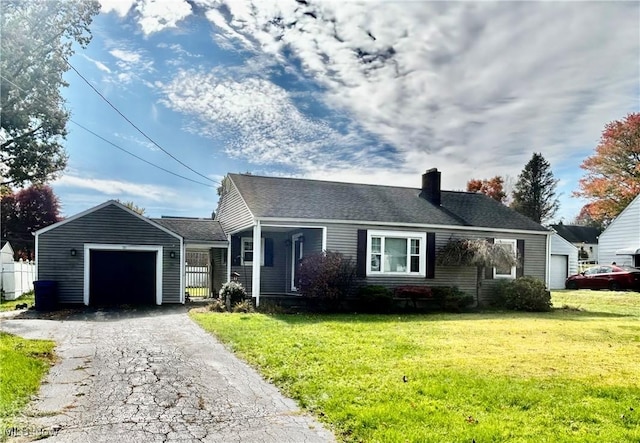 bungalow-style house featuring a garage and a front lawn