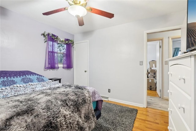 bedroom featuring hardwood / wood-style flooring and ceiling fan