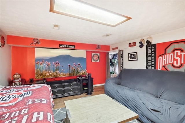 bedroom with wood-type flooring