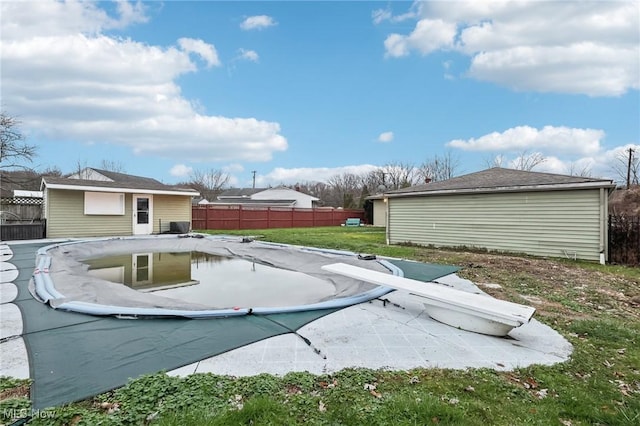 view of yard with a covered pool