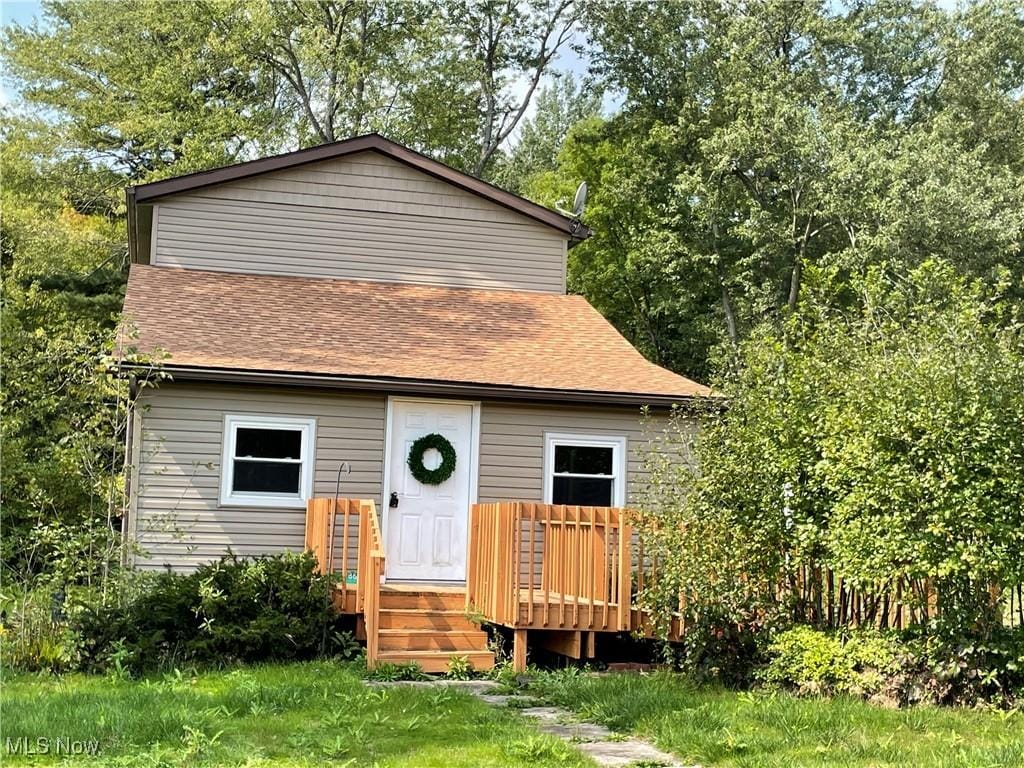 view of front of house with a wooden deck