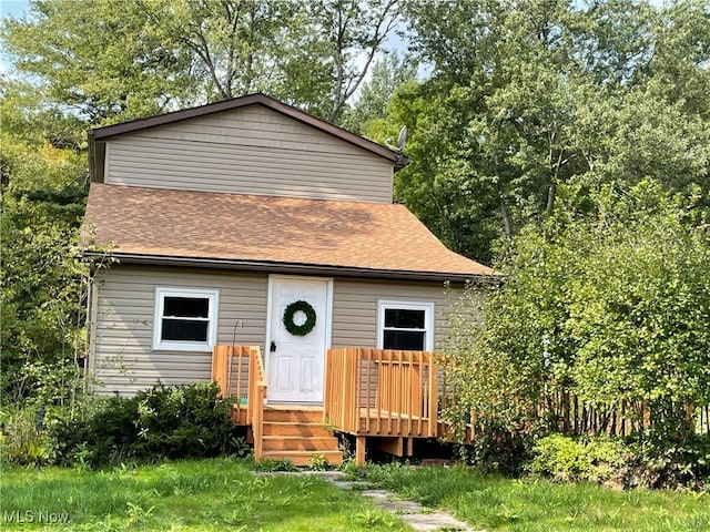 view of front of house with a wooden deck