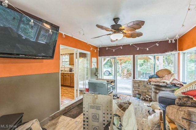 interior space featuring sink, a wealth of natural light, and ceiling fan