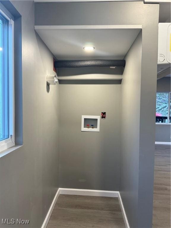 clothes washing area featuring hookup for a washing machine and hardwood / wood-style flooring