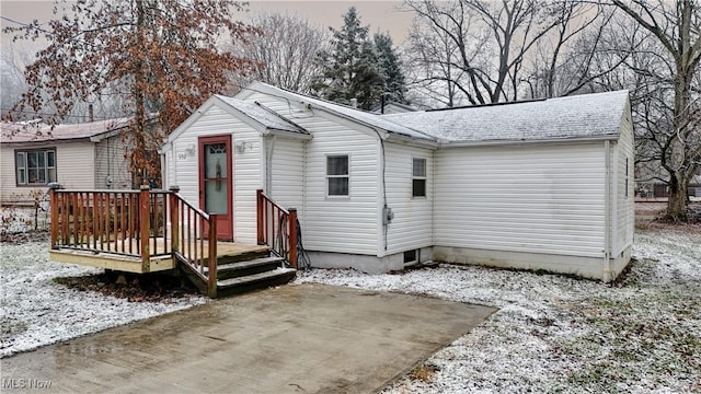 view of front of property with a wooden deck