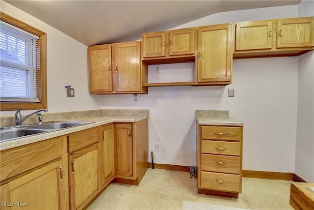 kitchen featuring sink and vaulted ceiling