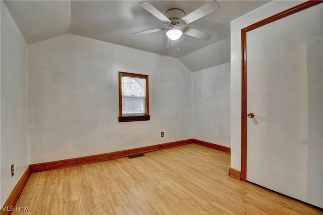 bonus room with light hardwood / wood-style flooring, ceiling fan, and lofted ceiling