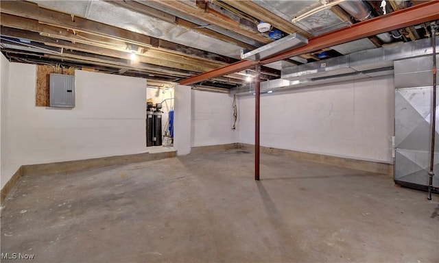 basement with electric panel and heating unit