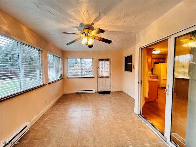 unfurnished room with ceiling fan, light hardwood / wood-style flooring, and a baseboard radiator