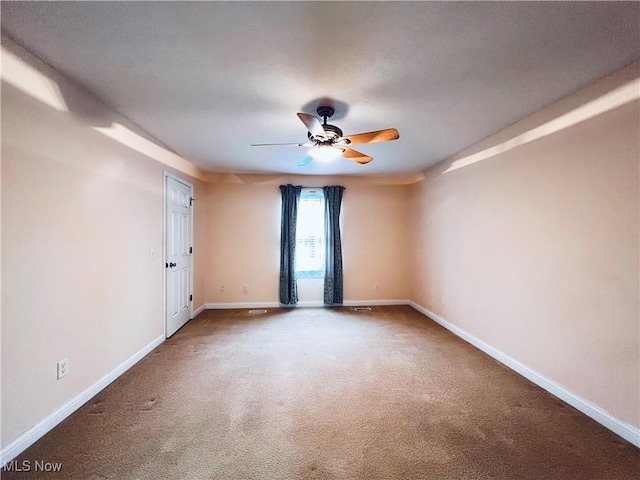 carpeted empty room with ceiling fan