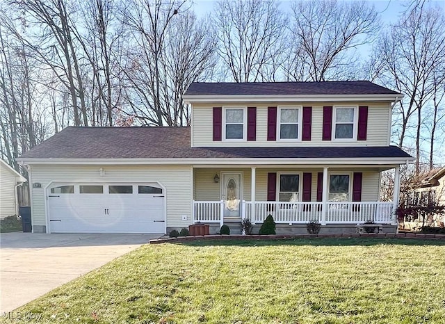 view of front of house with a front yard, a garage, and covered porch