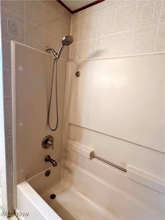 bathroom with shower / tub combination