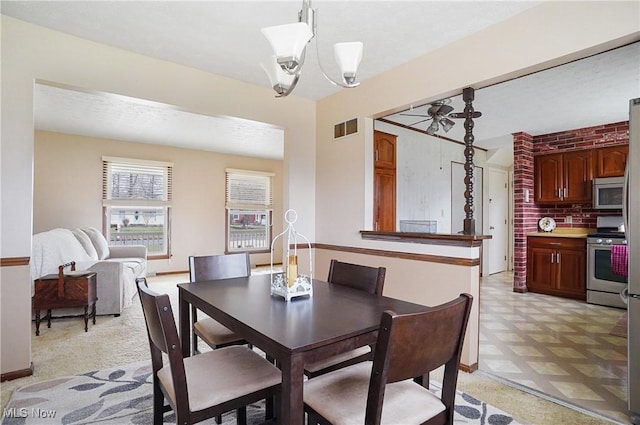 dining room with a chandelier