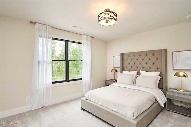 bedroom with light colored carpet