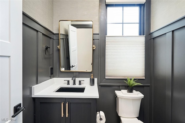 bathroom featuring vanity and toilet