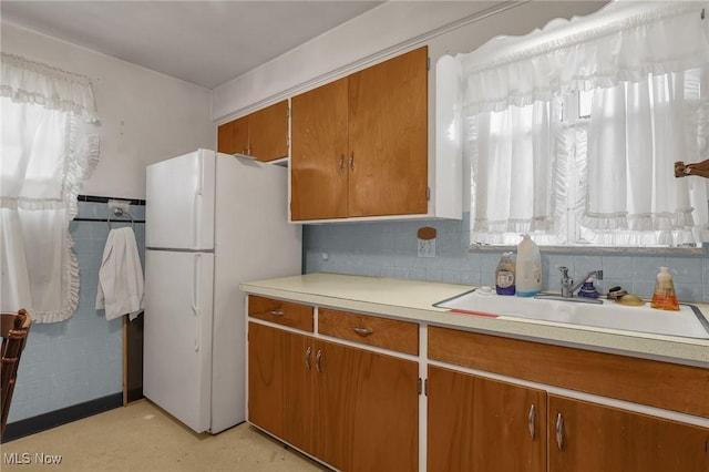 1956 Bluff Ave, Columbus, OH 43212 - kitchen featuring a wealth of natural light, sink, and white refrigerator