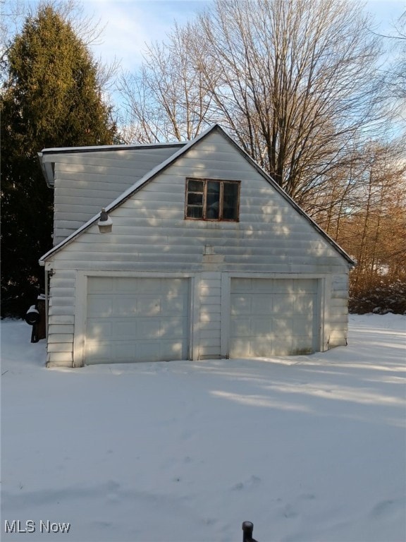 view of snow covered garage