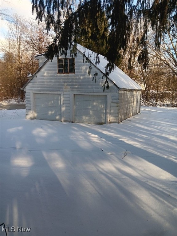 view of snow covered garage