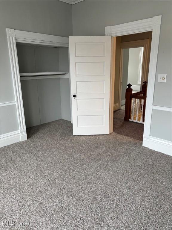 934 Main St, Wellsville, OH 43968 - unfurnished bedroom featuring carpet flooring and a closet