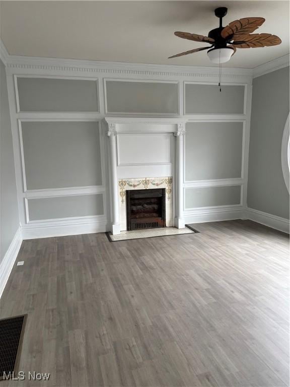934 Main St, Wellsville, OH 43968 - unfurnished living room with ceiling fan, a fireplace, and wood finished floors