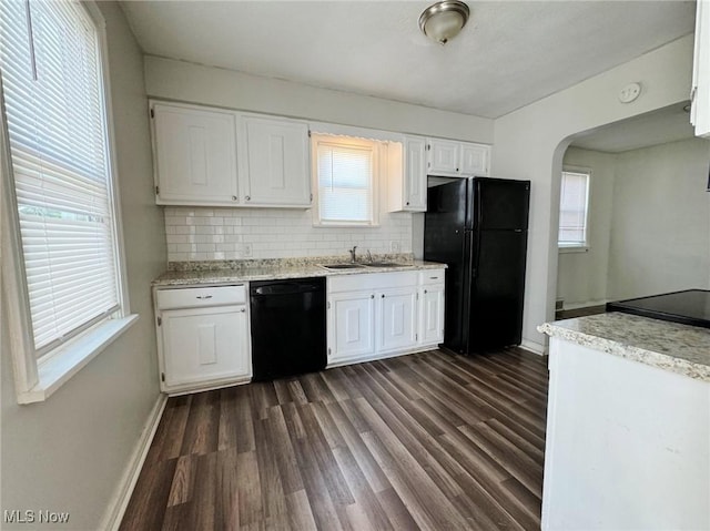 kitchen with backsplash, black appliances, white cabinets, sink, and dark hardwood / wood-style flooring