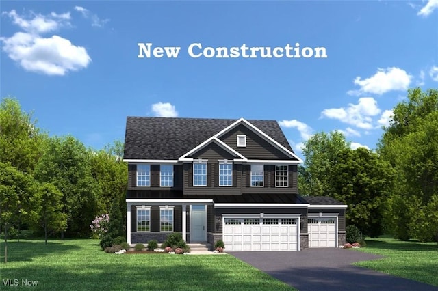 view of front of house featuring a front lawn and a garage