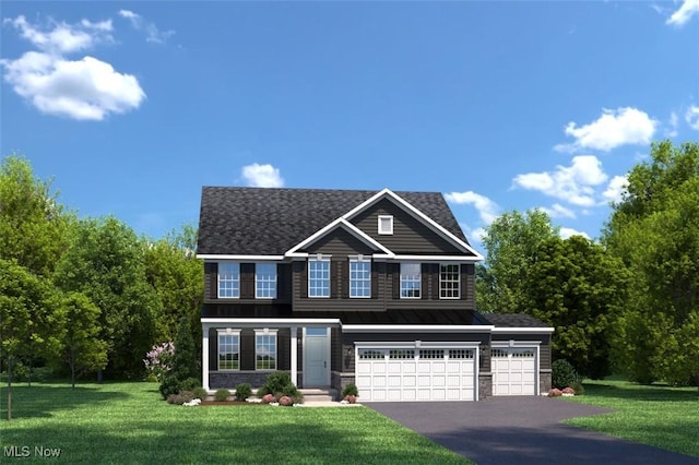 view of front of house with a front yard and a garage