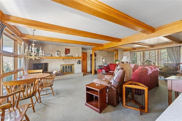 carpeted living room featuring beamed ceiling, an inviting chandelier, and a fireplace