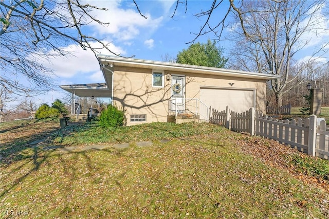 back of property with a garage