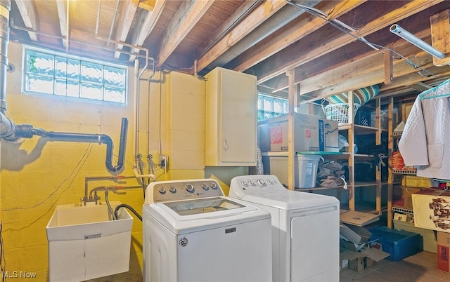 laundry area featuring sink and washer and dryer